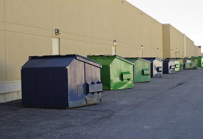 dumpsters with safety cones in a construction area in Alexandria